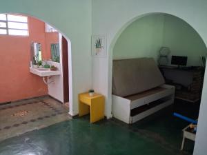 a living room with a couch and a table at Sítio Limão Cravo in Areias