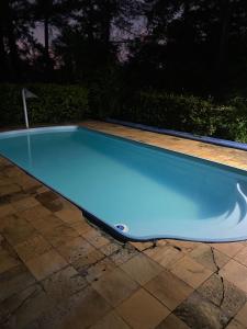 a swimming pool in a yard at night at Sítio Limão Cravo in Areias