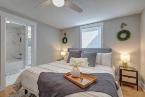 a bedroom with a large bed with a tray on it at 25 OFF 1 Mile to IU Walk to Town in Bloomington +135 photos
