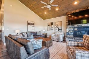 a living room with couches and a fireplace at THE VIEW Hot Tub Fire Pit Private in McHenry