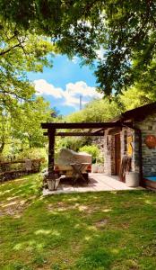 a picnic shelter with a picnic table in a yard at New IL RICCIO in Cernobbio