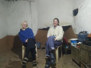 two women sitting in chairs in a room at Sidi hssain in Amizmiz