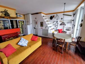 a living room with a couch and a table at Due balconcini sul mare in Santa Margherita Ligure