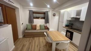 a small apartment with a couch and a table in a room at La Nicchia in Pieve di Cadore