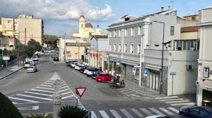 a view of a city street with cars parked at Hotel Centrale in Quartu SantʼElena