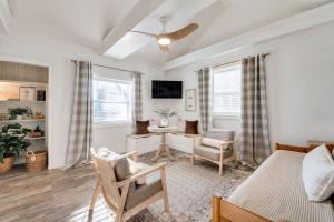 a living room with a bed and a desk with chairs at 1- Lookout Mountain Cottage in Lookout Mountain