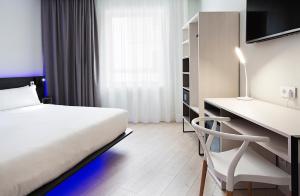 a bedroom with a white bed and white walls at B&B Hotel Madrid Centro Puerta del Sol in Madrid