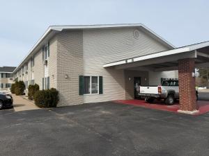 a building with a truck parked in the garage at Iron Mountain Inn & Suites MI US 2 in Iron Mountain +84 photos