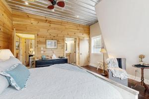 a bedroom with a large bed and a bathroom at Valley Vista Vacay 2 in Littleton