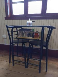 a black table with a glass top on top at Puerto sureño in Puerto Montt +17 photos