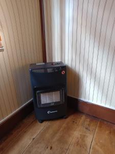 a air conditioner sitting on the floor in a room at Puerto sureño in Puerto Montt