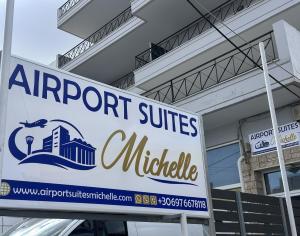 a sign for the entrance to an airport suites middle at Airport Suites Michelle in Spata