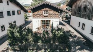 an overhead view of a wooden house with a fence at Luna Mia 1 Chalet in Schwangau
