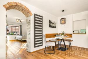 a living area with a table and a dining room at Ferienwohnung Antretter **** in Neubeuern