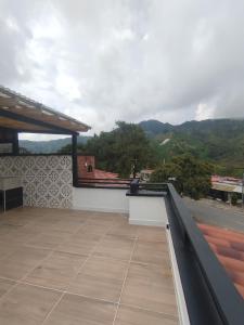 a balcony with a view of a mountain at Terra loft in Líbano
