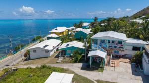 an aerial view of a town next to the ocean at Posada Three Cay Suites in Providencia