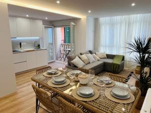a living room with a couch and a table at RÍA LIVING - Arena 01 in Cee