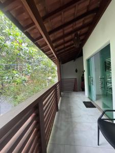 a balcony of a house with a wooden ceiling at Flat Bluvi Centro de Barra-Grande in Marau +7 photos