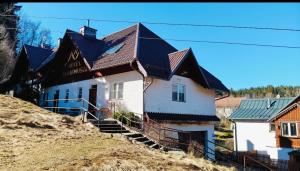 a house on the side of a hill at Hotel Karkonosze in Karpacz