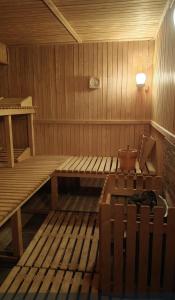 a sauna with a bench and a pot on it at Hotel Karkonosze in Karpacz +38 photos