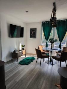 a living room with a table and chairs at Ferienwohnung Kampić Hirsch & Heimat in Rottweil