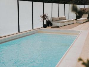 a swimming pool in the middle of a patio at Casa Moinho Vedro in Quintiães