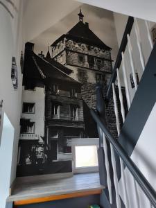 a staircase with a picture of a building on the wall at Ferienwohnung Kampić Turmblick in Rottweil