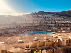 arial view of a building with a swimming pool at المونت جلاله - ll Monte Galala Ain Sokhna in Ain Sokhna