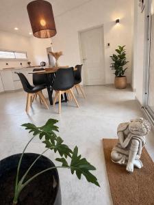 a living room with a table and chairs and a dining room at Departamento Parque, Asador y Pileta Privada, uso exclusivo in San Luis