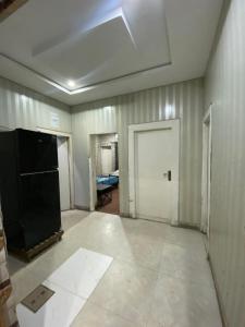 an empty room with a white door and a room with a room at Getaway lodge Guesthouse in Islamabad