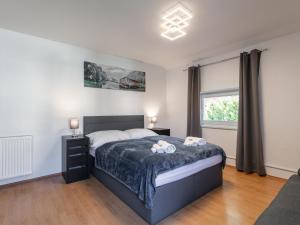 a bedroom with a bed with two towels on it at Gästehaus Inntal in Radfeld