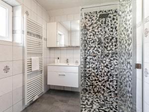 a bathroom with a shower and a sink at Gästehaus Inntal in Radfeld +32 photos