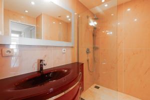 a bathroom with a red sink and a shower at Rives dor4B in Juan-les-Pins +16 photos