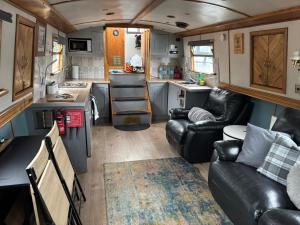 a small kitchen and living room in an rv at The Erne Rambler in Silverhill