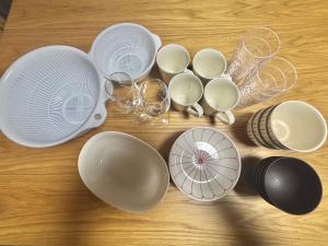 a group of white plates and bowls on a table at HoTTOSTAY矢田 in Nagoya +29 photos