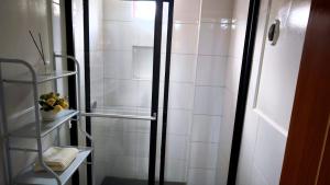 a bathroom with a shower with a glass door at Böttger Haus in Oxapampa