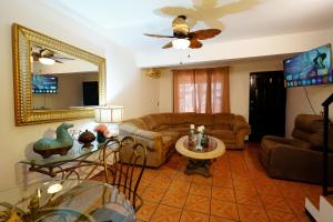 a living room with a couch and a table at Ribera Dorada in Monterrey