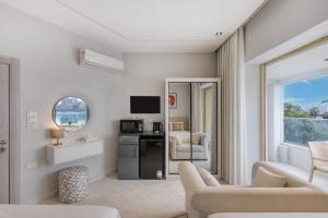 a living room with a couch and a television in a room at Cairo Homes Nile View Studios Manial in Cairo