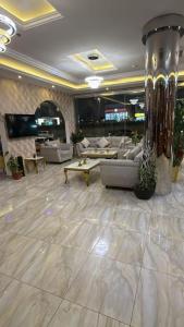 a lobby with couches and tables in a building at كاسا للشقق المخدومة 2 in Dammam