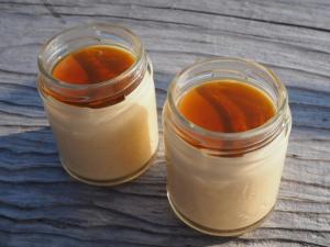 two mason jars filled with food on a wooden table at Jupiter 糸島市1棟貸し切り宿 in Itoshima