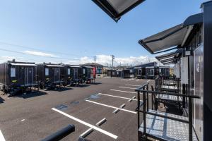 a parking lot with a lot at HOTEL R9 The Yard Shintomi in Imabyū +16 photos