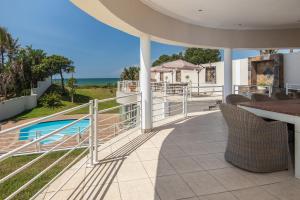 a view from the balcony of a house with a swimming pool at The Beach Palace Ramsgate in Margate