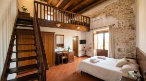 a bedroom with a large bed and a staircase at Hotel Lady Lusya in Syracuse