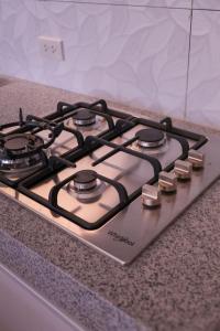 a stove top oven sitting on top of a counter at C Urban Villas 2 in Dau