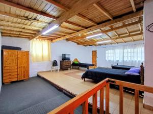 a bedroom with a bed and a desk in a room at Departamento TERRA ANDRAY centro in Famatina