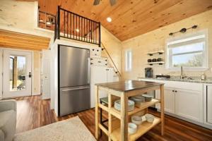 a kitchen with a stainless steel refrigerator and a counter at Lake Cumberland Retreat in Faubush +9 photos
