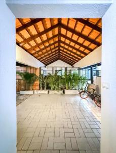 a large building with a large room with plants at Pridi cozy home with good location Type B in Bangkok