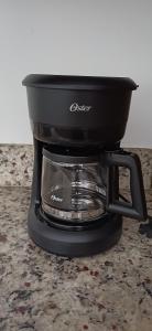a black coffee maker sitting on a counter at Condo Sunset in Cabo San Lucas