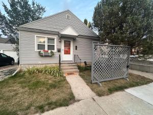 a small house with a gate in front of it at Pets Welcome Walkable Downtown Apt Gym & Pool Pass in Sheridan