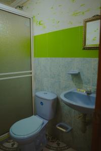 a bathroom with a toilet and a sink at POSADA NATIVA DERMA´S INN in San Andrés +67 photos